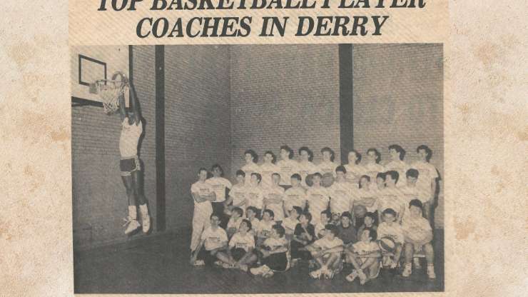 Coach Brown Performs a Dunk at his Basketball Clinic in Europe. Appeared in the newspaper article, “Top Basketball Player Coaches in Derry”